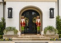 Two Nutcrackers guarding the door of a mansion in Highland Park at Christmas in Dallas County, Texas