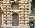 Two of several frescoes by Diego Esquivel in the textured wall behind the Mercury pond in the gardens of Real Alcazar in Seville.