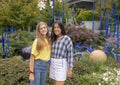 Teenage cousins pose before outdoor exhibit in the garden, Chihuly Garden and Glass in the Seattle Center