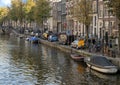 Typical street and houses along a canal, Amsterdam, The Netherlands Royalty Free Stock Photo