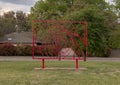 Rectangular red painted steel sculpture in the Abstract Sculpture Garden of the Museum of Biblical Art in Dallas, Texas