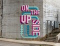 `On The Up Side`, a mural at the underpass where the historic Katy Trail passes over Bowen Street in Uptown, Dallas, Texas.