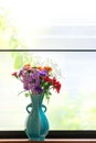 Various kind of flowers in the blue vase Royalty Free Stock Photo