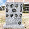 War monument to Ten Boys From Dallas in the Veterans Memorial Garden with Dallas Memorial Auditorium in the background. Royalty Free Stock Photo