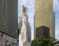 Marble statue of a classic female figure by Marton Varo in front of the Plaza of the Americas