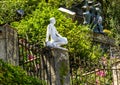 White marble sculpture of a man sitting in the Museo del Parco in Portofino, Italy