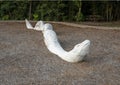 Stone rattlesnake sculpture at the north end of the Galatyn Naure Trail in Richardson, Texas.