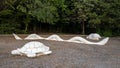 Stone turtle, rattlesnake and rabbit sculptures at the north end of the Galatyn Naure Trail in Richardson, Texas.