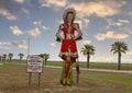 Wooden art piece featuring Uvalde native Dale Evans along US 90 Highway passing through Uvalde, Texas.