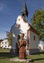 Wooden sculpture St. John of Nepomuk with small chapel, The Village of Holasovice, Czech Republic Royalty Free Stock Photo