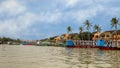 Tour Boats lined up waiting for customers on the Thu Bon River in Hoi An, Vietnam