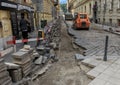 Preparing to lay new electrical lines under street, Budapest, Hungary