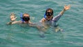 47 year-old Caucasian husband and his 57 year-old Korean wife enjoying snorkeling in Santa Maria Bay near San Cabo Lucas