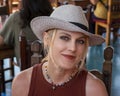 50 year-old stylish Caucasian woman enjoying lunch on a patio in Todos Santo, Mexico.