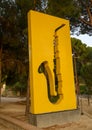 Saxo, a yellow aluminum sculpture by Sosno in La Pinede, Juan-les-Pins