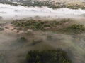 Pictures of the drone flight over the fog. River, forest, fields and meadows on a misty summer dawn. Summer Royalty Free Stock Photo