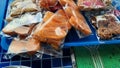 Pictures of food prepared in bags for sale in a small market