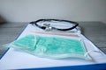 Pictures of medical surgical masks and stethoscope are on the prescription documents in the hospital dispensing room