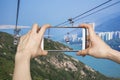 Pictures on mobile smart phone in Cable car,from Hong Kong Ocean Park Royalty Free Stock Photo