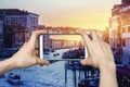 pictures on mobile smart phone in Canal Grande in sunset night view in Venice, Italy Royalty Free Stock Photo