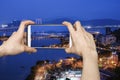 Pictures on mobile smart phone in View point Bridge in Macau at night