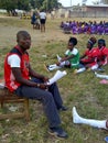 Sport Students sitting on the grass for sport class Royalty Free Stock Photo