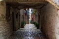 Picturesque arch with a colorful street at the background in the old town of Rovinj, Croatia