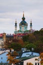 Picturesque autumn cityscape of Kyiv. Saint Andrew`s Church and ancient buildings of Andrew`s Descent Andriyivsky uzviz Royalty Free Stock Photo