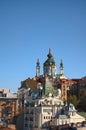 Picturesque autumn cityscape of Kyiv. Saint Andrew`s Church and ancient buildings of Andrew`s Descent Royalty Free Stock Photo