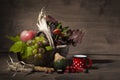 Picturesque autumn composition with basket, fruits, pumpkin, mug Royalty Free Stock Photo