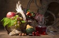 Picturesque autumn composition with basket, fruits, pumpkin, mug