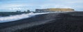 Picturesque autumn Dyrholaey Cape and  rock formations view from Reynisfjara ocean black volcanic sand beach. Vik, South Iceland Royalty Free Stock Photo