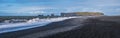 Picturesque autumn Dyrholaey Cape and  rock formations view from Reynisfjara ocean black volcanic sand beach. Vik, South Iceland Royalty Free Stock Photo