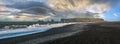 Picturesque autumn Dyrholaey Cape and  rock formations view from Reynisfjara ocean black volcanic sand beach. Vik, South Iceland Royalty Free Stock Photo