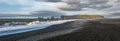 Picturesque autumn Dyrholaey Cape and  rock formations view from Reynisfjara ocean black volcanic sand beach. Vik, South Iceland Royalty Free Stock Photo