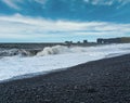 Picturesque autumn Dyrholaey Cape and rock formations view from Reynisfjara ocean black volcanic sand beach. Vik, South Iceland Royalty Free Stock Photo