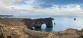 Picturesque autumn evening view to Dyrholaey coast cliffs and rocky arch, Vik, South Iceland. Reynisfjara ocean  black volcanic Royalty Free Stock Photo