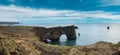 Picturesque autumn evening view to Dyrholaey coast cliffs and rocky arch, Vik, South Iceland. Reynisfjara ocean  black volcanic Royalty Free Stock Photo