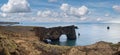 Picturesque autumn evening view to Dyrholaey coast cliffs and rocky arch, Vik, South Iceland. Reynisfjara ocean  black volcanic Royalty Free Stock Photo