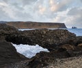 Picturesque autumn evening view to Reynisfjara ocean black volcanic sand beach and rock formations from Dyrholaey Cape, Vik, Royalty Free Stock Photo