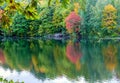 Picturesque autumn landscape with colorful trees and their reflection in the lake Royalty Free Stock Photo