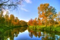Picturesque Autumn Landscape Of Steady River And Bright Trees