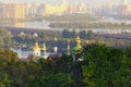 Picturesque autumn landscape view of ancient Vydubychi Monastery, Dnipro River and high-rise buildings on the left bank of Dnipro Royalty Free Stock Photo