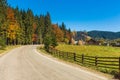 Picturesque autumn road in mountain village