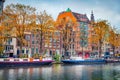 Picturesque autumn scene of Amsterdam city. Famous Dutch channels and great cityscape. Colorful morning landscape in Netherlands,