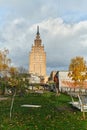A picturesque autumn scene in the city of Riga, Lithuania, featuring a park with traditional Lithuanian houses