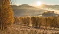 Picturesque autumn view, sunrise. Morning fog over a mountain valley, autumn Royalty Free Stock Photo