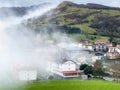 Picturesque Basque village of Aia in the province of Guipuzkoa, Spain shrouded in fog Royalty Free Stock Photo