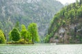 picturesque bavarian lake, koenigssee, bavaria, germany. The landscape of a mountain lake with a small island in the middle.