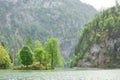 picturesque bavarian lake, koenigssee, bavaria, germany. The landscape of a mountain lake with a small island in the middle.